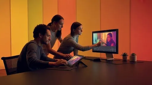 Professionals using software tools for color grading process