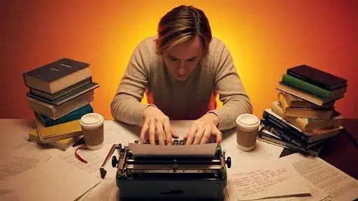 A young screenwriter working on a screenplay A young screenwriter working on a screenplay